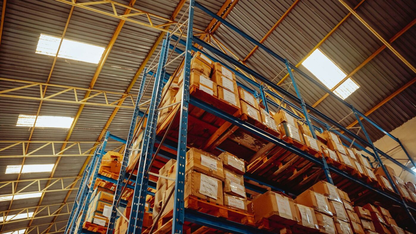 Warehouse racking stocked with boxed goods ready for distribution